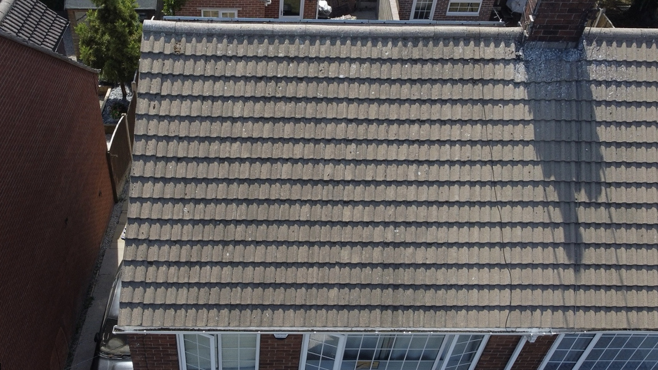 Roof scrape and biocide treatment